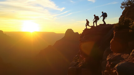 Fototapeta premium Two Hikers Silhouetted Against a Breathtaking Sunrise, One Extending a Helping Hand to Pull the Other Up a Steep Cliff, Symbolizing Teamwork, Perseverance, and Determination in a Rugged Mountain Lands