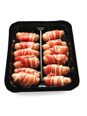 Pigs in blanket in a black plastic tray on white background. Party pork food . Tasty appetizers. Simple meal.