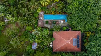 Drone Aerial view at sunrise of the beautiful Bluff Beach Retreat hotel with pool and Bluff Beach...