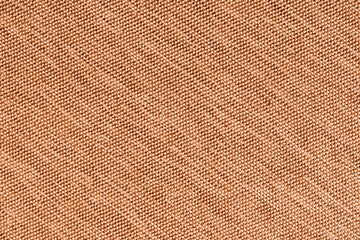 Closeup, macro of orange fabric texture background. Satin diagonal weaving cloth structure, canvas....