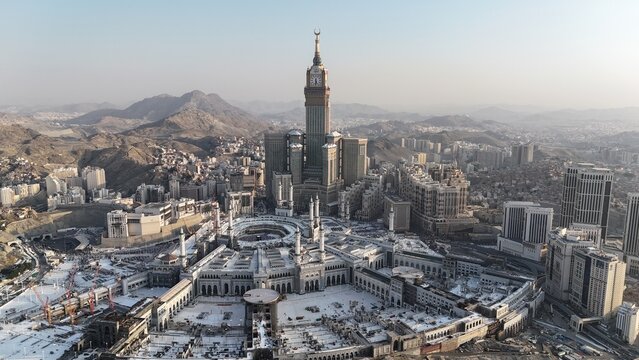 Mecca , Saudi Arabia Mars 30 2024: Makkah city Streets hotels and transportation Makkah Clock Tower - Masjid Al Haram drone aerial view
