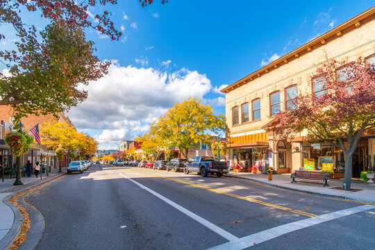 Sherman Avenue, the main street of cafes and shops through the picturesque downtown of the lakefront city of Coeur d'Alene, Idaho at autumn.