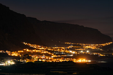 Night view on colonial old town Garachico, mountains, ocean, banana plantations, on Tenerife as...