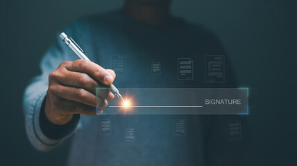 Electronic signature concept, Technology for document management, Businessman using pen sign signature on electronic E-signing on virtual screen, Paperless office, Future business contract signing.