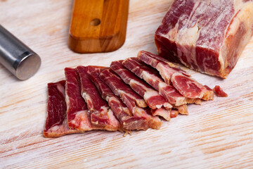 Traditional Spanish delicacy lacon curado - jerky pork ham. High quality photo