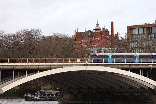 Train passing the bridge over river Thames