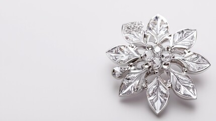 Naklejka premium Elegant Silver Flower Brooch with Crystal Accents on White Background