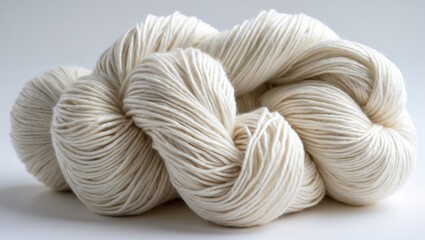 Milk cotton yarn in soft white showcasing texture and quality on a minimalist background for textile design and crafting projects