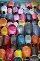 Close up view of Slippers or sandals of many colors hung from street stalls