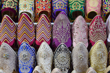 Close up view of Slippers or sandals of many colors hung from street stalls