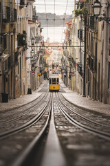 Bica Funicular in the city of Lisbon. Typical yellow tram from Portugal.