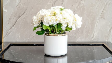 White hydrangeas in modern vase, marble table, luxury interior