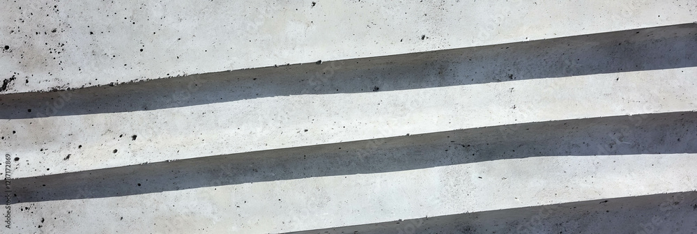 Poster abstract concrete surface with wide horizontal ribs for architectural design