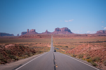 View of a road with the monument Valley in the background