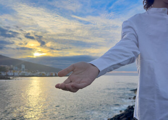 Jesus Christ giving his arm, hand gestures of Jesus dying on the cross and resurrected,