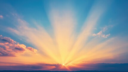 Obraz premium Sun rays breaking through dramatic colorful sky with soft clouds