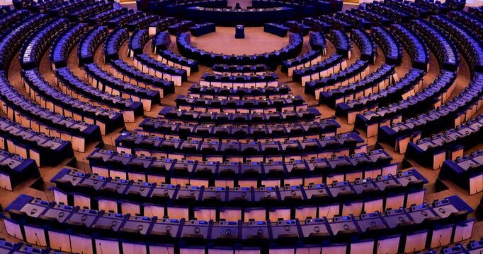 The European Parliament hemicycle stands empty, with open communication and voting equipment set up for the newly elected legislature to inspect and begin its work.
