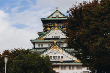 Naklejka premium Osaka Castle, Osaka city, Japan, summer landscape vibrant view with a blue sky, Osakajo castle building, Kansai region, Osaka prefecture, travel to Japan