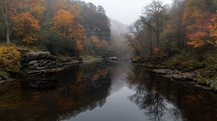 Obraz premium Autumnal river reflection in misty valley