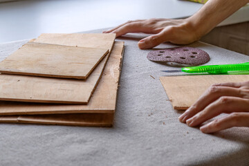 Process of making plywood box with your own hands. DIY, joinery, plywood blanks for making box and grinding wheel for grinding machine