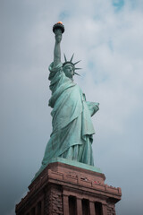 Close-up view of the Statue of Liberty in New York City, highlighting its iconic torch and face.