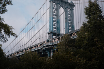 Close-up of Manhattan Bridge's detailed steel structure in New York City.