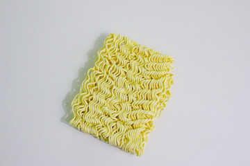 Yellow raw instant noodles or dry noodles on white background