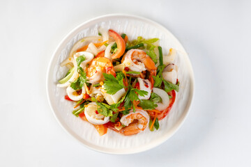Spicy seafood salad, Thai spicy food recipe, Yum Spicy seafood on a white background