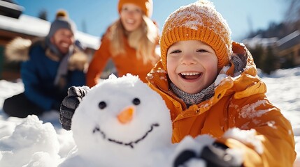 Joyful winter day making snowman in sunny snowy landscape