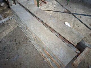 photo of a pile of plywood for cast formwork