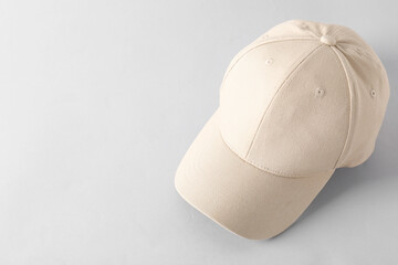 Stylish baseball cap on light grey background. Mockup for design