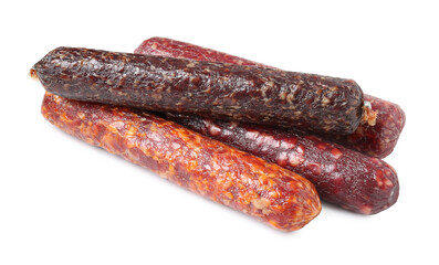 Many different dry cured sausages isolated on white