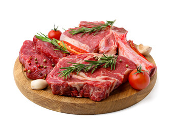 Pieces of raw beef meat, spices and tomatoes isolated on white