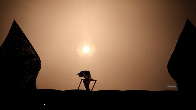 A scene of praying in a Wayang Kulit performance a traditional Javanese shadow puppet show in Indonesia
