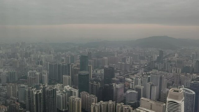 Bird's-eye view of city center in foggy morning, Guangzhou, China.