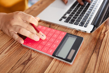 Workers use calculators and computers