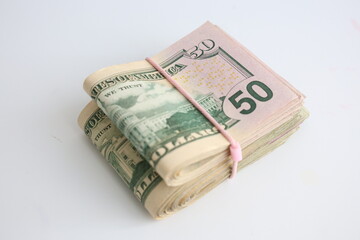 Two packs of 50 fifty dollar bills snug a rubber