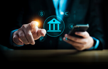 Businessman using smartphone and touching virtual banking icon with global currency symbols, representing digital banking, financial transactions, fintech, global economy, and online payment solutions