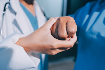 Orthopedist examining patient in hospital