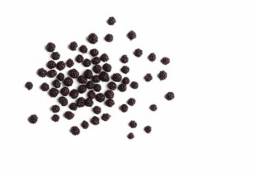 Bunch of fresh blueberries naturally scattered on a clean white background