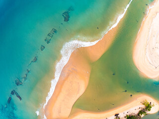 Summer seascape beautiful waves,Tropical sea water in sunny day, Top view from drone camera,Amazing ocean colorful nature background, Beautiful bright sea waves splashing on beach sand