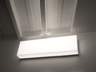 White hanging lightbox with blank space. Empty signage, wall mounted light box for advertising or...