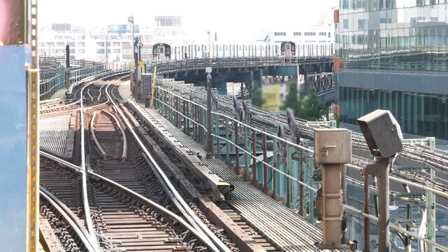 New York subway station. Metro train on metropolitan platform, United States public transportation. Elevated outdoor Queensboro Plaza railway line, Queens. NYC passenger railroad traffic, Long Island.