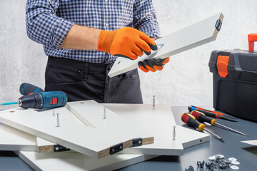 carpenter assembling new furniture.
