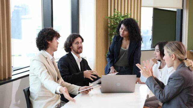 African woman sale manager is consulting over strategy to her colleagues in the executive meeting for next year plan with market share increase for global business and investment concept