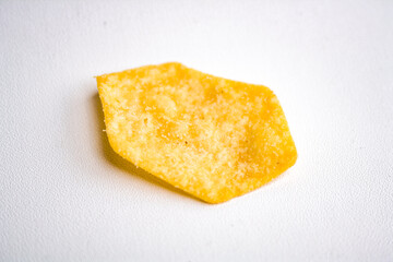 Hexagon-shaped potato chip on a white background