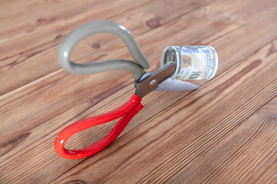 A scissors cut dollar bills