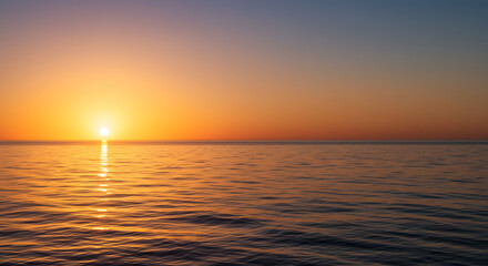 Fototapeta premium Ocean at Sunset with Golden Light Reflecting on Water Surface