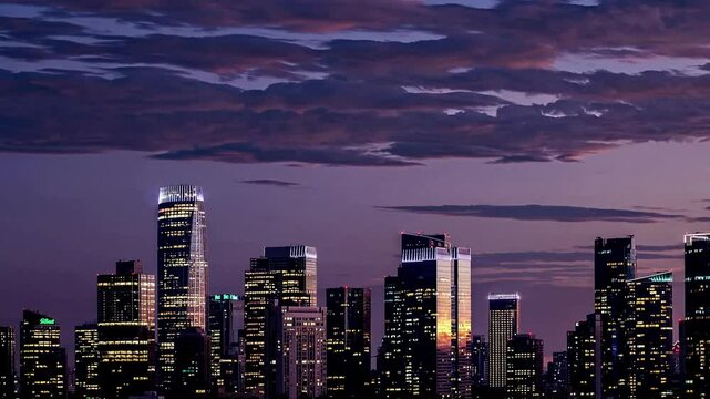 The magic of a city skyline transforming at dusk with a timelapse sunset. Showcasing urban life, transition, dynamic visuals.
