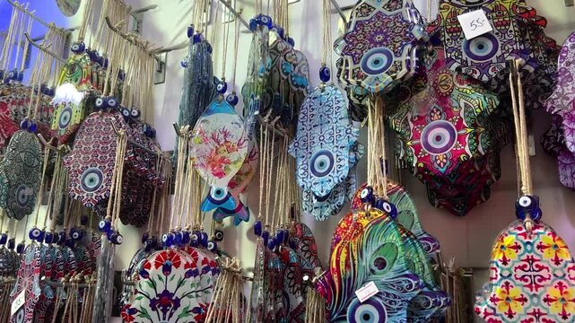 Nazar in market. Blue and red Fatima eye close-up protective amulet against evil eye. Israeli Hamsa David